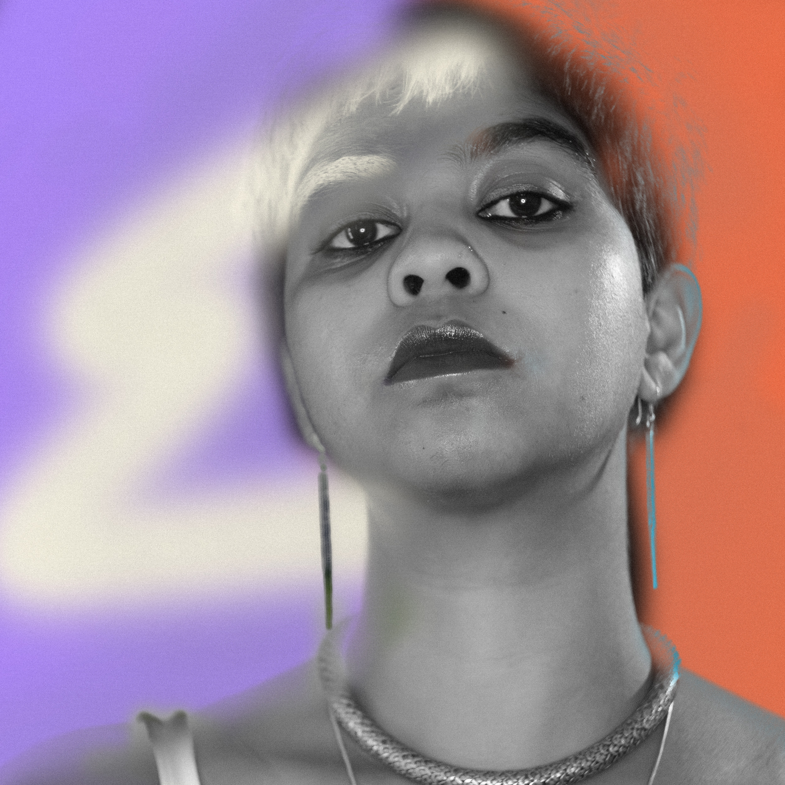 Risktakers Fellowship - The image depicts a greyed black-and-white photograph of Promona, one of the Risktaker fellows, on a background that